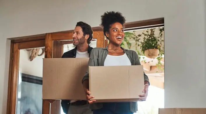 Grey Whales Removals team carrying moving boxes during a residential move in Sydney
