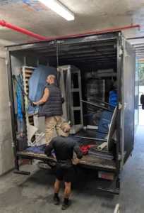 Grey Whales Removals team loading furniture into removals truck